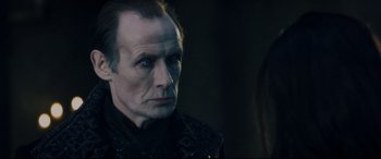 Movie still from “Underworld: Rise of the Lycans” (2009), directed by Patrick Tatopoulos – A person wearing a suit; Close Up shot, Over the shoulder angle