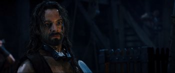 Movie still from “Underworld: Rise of the Lycans” (2009), directed by Patrick Tatopoulos – A person with long hair and a beard; Close Up shot, High angle
