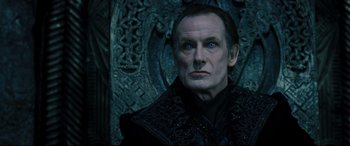 Movie still from “Underworld: Rise of the Lycans” (2009), directed by Patrick Tatopoulos – A person wearing a suit; Close Up shot, Low angle