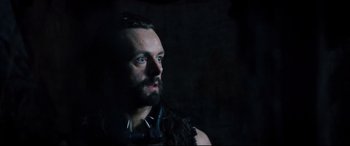 Movie still from “Underworld: Rise of the Lycans” (2009), directed by Patrick Tatopoulos – A man with long hair and a goatee stares into the distance; Close Up shot, Low angle