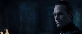 Movie still from “Underworld: Rise of the Lycans” (2009), directed by Patrick Tatopoulos – A person wearing a suit and tie; Close Up shot, Over the shoulder angle