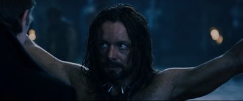 Movie still from “Underworld: Rise of the Lycans” (2009), directed by Patrick Tatopoulos – A person with long hair; Close Up shot, Over the shoulder angle