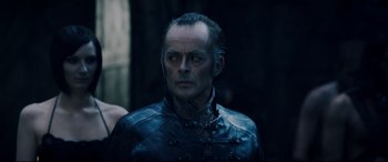 Movie still from “Underworld: Rise of the Lycans” (2009), directed by Patrick Tatopoulos – A person wearing a leather jacket; Close Up shot, Over the shoulder angle