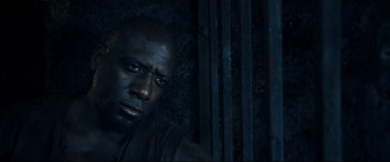 Movie still from “Underworld: Rise of the Lycans” (2009), directed by Patrick Tatopoulos – A man's face in the dark; Close Up shot, Low angle