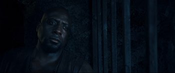 Movie still from “Underworld: Rise of the Lycans” (2009), directed by Patrick Tatopoulos – A person in a dark room; Close Up shot, High angle