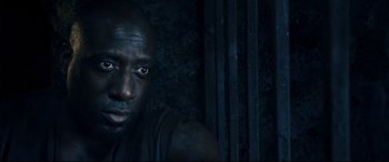 Movie still from “Underworld: Rise of the Lycans” (2009), directed by Patrick Tatopoulos – A person in a dark room; Close Up shot, High angle
