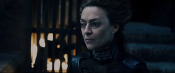 Movie still from “Underworld: Rise of the Lycans” (2009), directed by Patrick Tatopoulos – A person wearing a black outfit; Close Up shot, Over the shoulder angle