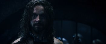 Movie still from “Underworld: Rise of the Lycans” (2009), directed by Patrick Tatopoulos – A person with long hair; Close Up shot, Over the shoulder angle