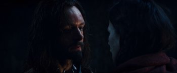 Movie still from “Underworld: Rise of the Lycans” (2009), directed by Patrick Tatopoulos – A man and a woman face to face in the dark; Close Up shot, Over the shoulder angle