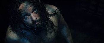 Movie still from “Underworld: Rise of the Lycans” (2009), directed by Patrick Tatopoulos – A man with long hair and a long beard; Close Up shot, High angle