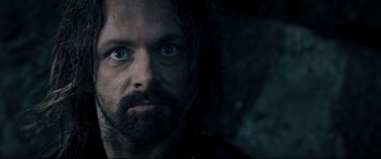 Movie still from “Underworld: Rise of the Lycans” (2009), directed by Patrick Tatopoulos – A person with long hair and blue eyes; Close Up shot, Low angle