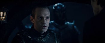 Movie still from “Underworld: Rise of the Lycans” (2009), directed by Patrick Tatopoulos – A person wearing a suit; Close Up shot, Over the shoulder angle