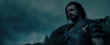 Movie still from “Underworld: Rise of the Lycans” (2009), directed by Patrick Tatopoulos – A person with long black hair; Close Up shot, Low angle