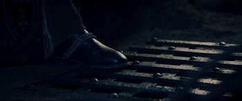 Movie still from “Underworld: Rise of the Lycans” (2009), directed by Patrick Tatopoulos – A person's foot wearing a shoe; Extreme Close Up shot, Low angle