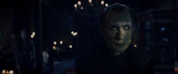 Movie still from “Underworld: Rise of the Lycans” (2009), directed by Patrick Tatopoulos – A person wearing a suit and tie; Close Up shot, Over the shoulder angle
