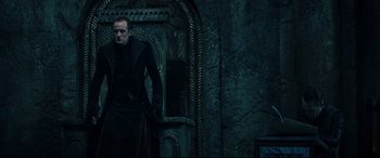 Movie still from “Underworld: Rise of the Lycans” (2009), directed by Patrick Tatopoulos – A man standing in front of a wall; Medium shot, Low angle