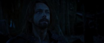 Movie still from “Underworld: Rise of the Lycans” (2009), directed by Patrick Tatopoulos – A person with long hair and a beard; Close Up shot, Low angle