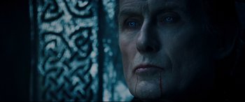 Movie still from “Underworld: Rise of the Lycans” (2009), directed by Patrick Tatopoulos – A person with blood on his face; Close Up shot, Overhead angle