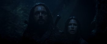 Movie still from “Underworld: Rise of the Lycans” (2009), directed by Patrick Tatopoulos – A man and a woman are standing in the dark; Close Up shot, Low angle