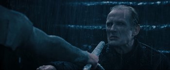 Movie still from “Underworld: Rise of the Lycans” (2009), directed by Patrick Tatopoulos – An old man in the middle of a rain storm; Close Up shot, High angle