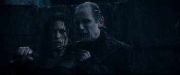 Movie still from “Underworld: Rise of the Lycans” (2009), directed by Patrick Tatopoulos – A man and a woman in the rain; Close Up shot, Over the shoulder angle