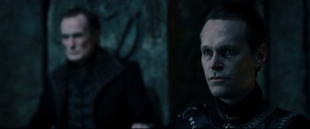 Movie still from “Underworld: Rise of the Lycans” (2009), directed by Patrick Tatopoulos – A person wearing a black jacket; Close Up shot, Over the shoulder angle