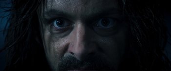 Movie still from “Underworld: Rise of the Lycans” (2009), directed by Patrick Tatopoulos – A man's face with blue eyes; Extreme Close Up shot, Overhead angle