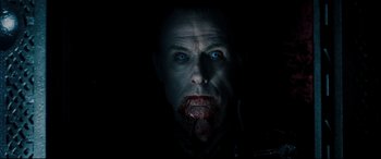 Movie still from “Underworld: Rise of the Lycans” (2009), directed by Patrick Tatopoulos – A person's face in the dark; Close Up shot, Overhead angle