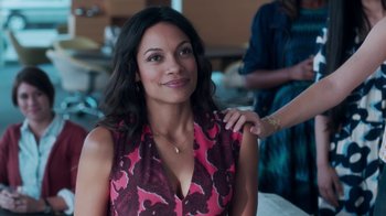 Movie still from “Unforgettable” (2017), directed by Denise Di Novi – A woman in a pink and purple dress is smiling; Close Up shot, Over the shoulder angle