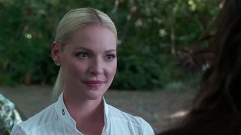 Movie still from “Unforgettable” (2017), directed by Denise Di Novi – A beautiful blond haired woman wearing a white shirt; Close Up shot, Over the shoulder angle