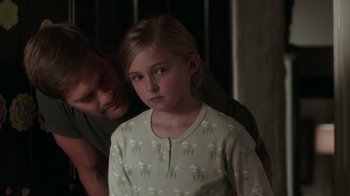 Movie still from “Unforgettable” (2017), directed by Denise Di Novi – A man helping a young girl in a nightgown; Close Up shot, Over the shoulder angle