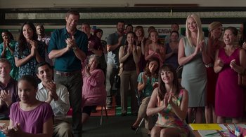Movie still from “Unforgettable” (2017), directed by Denise Di Novi – A group of people standing in front of a crowd; Wide shot, Over the shoulder angle