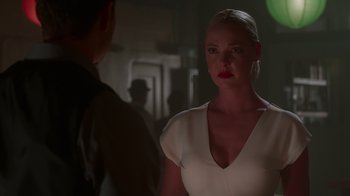 Movie still from “Unforgettable” (2017), directed by Denise Di Novi – A woman in a white dress talking to a man in a black suit; Close Up shot, Over the shoulder angle