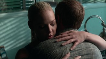 Movie still from “Unforgettable” (2017), directed by Denise Di Novi – A man and a woman hugging each other in front of a window; Close Up shot, Over the shoulder angle