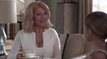 Movie still from “Unforgettable” (2017), directed by Denise Di Novi – A woman sitting at a table with a cup of coffee; Close Up shot, Over the shoulder angle