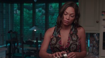 Movie still from “Unforgettable” (2017), directed by Denise Di Novi – A beautiful woman in a brown and black dress; Medium shot, Over the shoulder angle