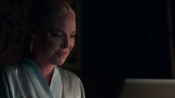 Movie still from “Unforgettable” (2017), directed by Denise Di Novi – A woman looking at a computer screen in the dark; Close Up shot, Over the shoulder angle