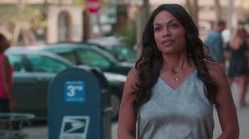 Movie still from “Unforgettable” (2017), directed by Denise Di Novi – A woman standing in front of a mailbox on a sidewalk; Medium shot, Over the shoulder angle