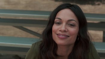 Movie still from “Unforgettable” (2017), directed by Denise Di Novi – A person with long black hair smiling; Close Up shot, Over the shoulder angle