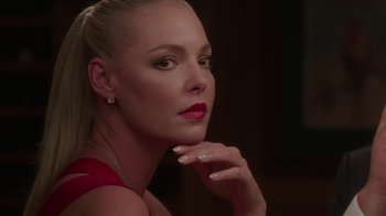 Movie still from “Unforgettable” (2017), directed by Denise Di Novi – A beautiful woman with red lipstick looking at the camera; Close Up shot, Low angle