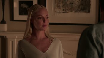 Movie still from “Unforgettable” (2017), directed by Denise Di Novi – A beautiful blonde woman with long hair wearing a white top; Close Up shot, Over the shoulder angle