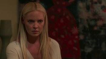 Movie still from “Unforgettable” (2017), directed by Denise Di Novi – A woman with long blonde hair wearing a white shirt; Close Up shot, Over the shoulder angle