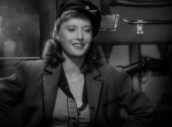 Movie still from “Union Pacific” (1939), directed by Cecil B. DeMille – A black and white photo of a woman wearing a hat; Close Up shot, Over the shoulder angle