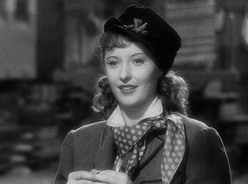 Movie still from “Union Pacific” (1939), directed by Cecil B. DeMille – A black and white photo of a woman wearing a hat; Close Up shot, Over the shoulder angle