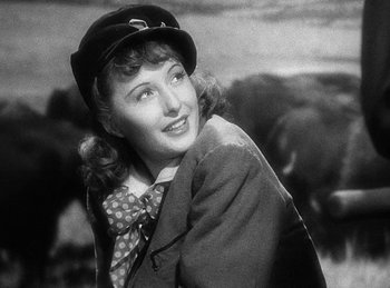 Movie still from “Union Pacific” (1939), directed by Cecil B. DeMille – An old black and white photo of a woman wearing a hat; Close Up shot, Low angle