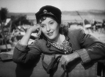 Movie still from “Union Pacific” (1939), directed by Cecil B. DeMille – An old photo of a woman with a hat on; Close Up shot, Low angle