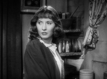 Movie still from “Union Pacific” (1939), directed by Cecil B. DeMille – A black - and - white photo of a woman in front of a mirror; Close Up shot, Over the shoulder angle