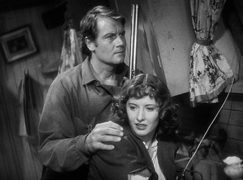 Movie still from “Union Pacific” (1939), directed by Cecil B. DeMille – A man and a woman are getting their hair cut; Medium shot, Low angle