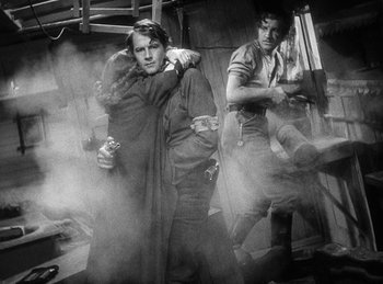 Movie still from “Union Pacific” (1939), directed by Cecil B. DeMille – A man and a woman hugging in a room; Medium shot, Over the shoulder angle