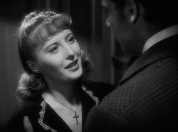 Movie still from “Union Pacific” (1939), directed by Cecil B. DeMille – An old photo of a man and a woman; Close Up shot, Over the shoulder angle